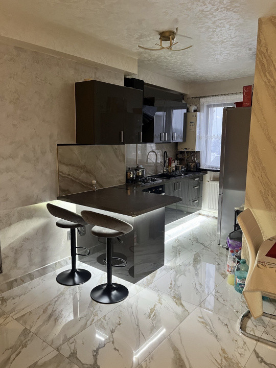 Apartament 59 mp utili+terasa de 18 mp,parcare subterana,centru Gilau