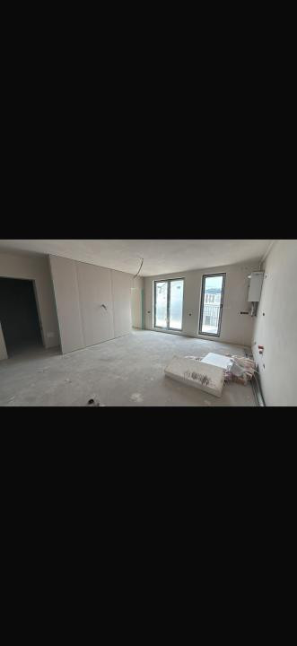 Apartament cu 2 camere ,etaj intermediar ,terasă,parcare subterană , zona Eroilo
