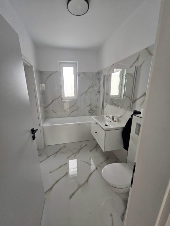 Apartament  cu 3 camere,2bai si 2 parcari