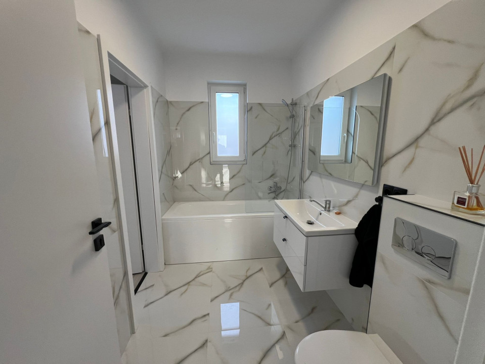 Apartament  cu 3 camere,2bai si 2 parcari