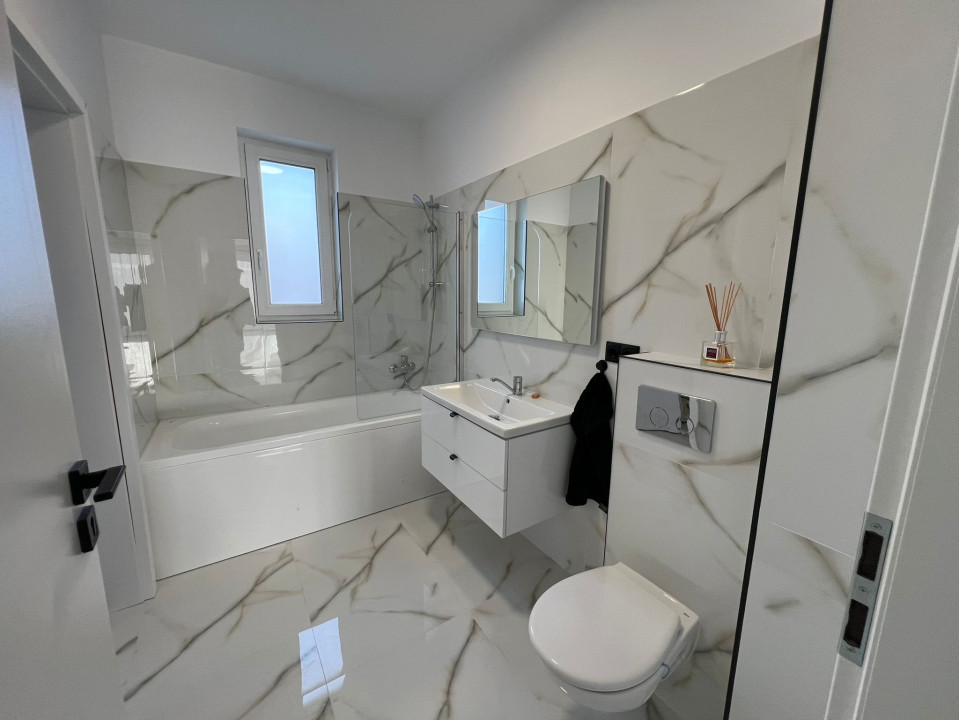 Apartament  cu 3 camere,2bai si 2 parcari